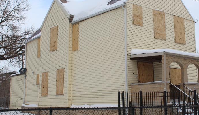Boarded up house
