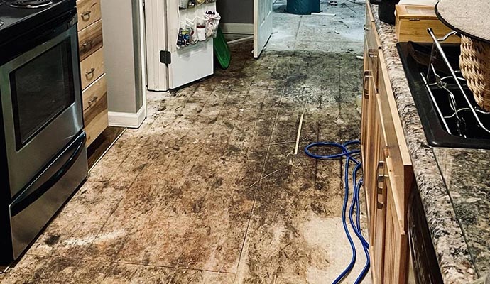 Water damaged kitchen floor Water damaged kitchen floor