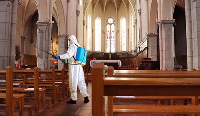 Professional worker disinfecting church