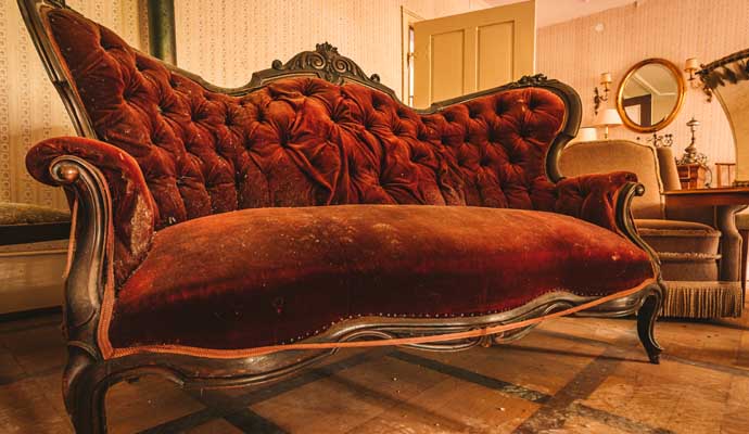 A clean Antique red velvet sofa 