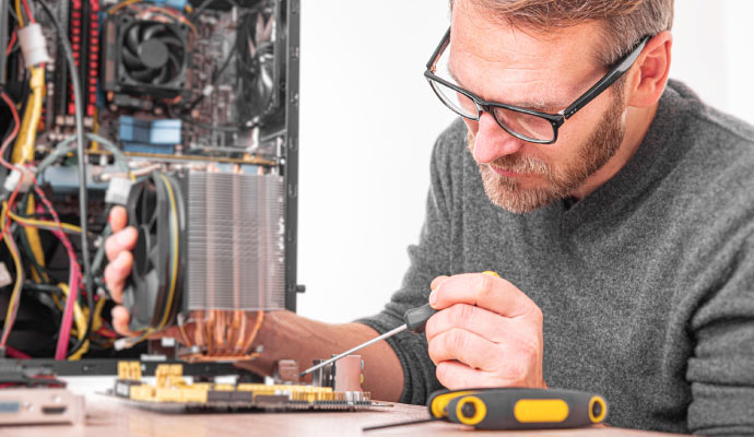 A person restoring electronics using equipment