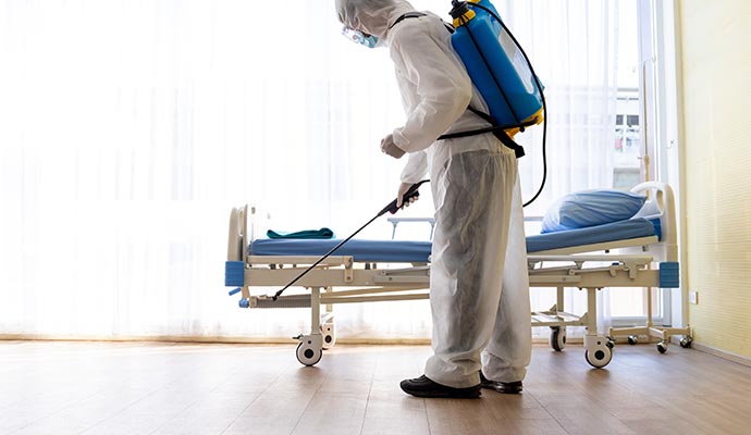 a person is disinfecting a hostipal floor