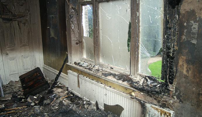 burned room with visible damage