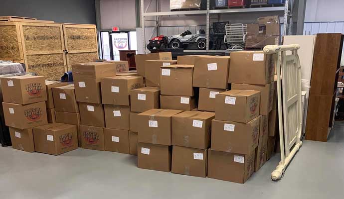 A warehouse storage area filled with cardboard boxes