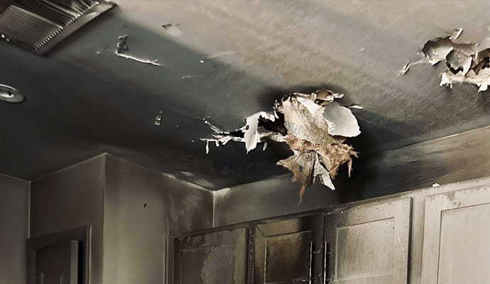 The ceiling damaged by fire