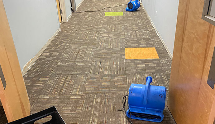 Drying a wet corridor with equipment